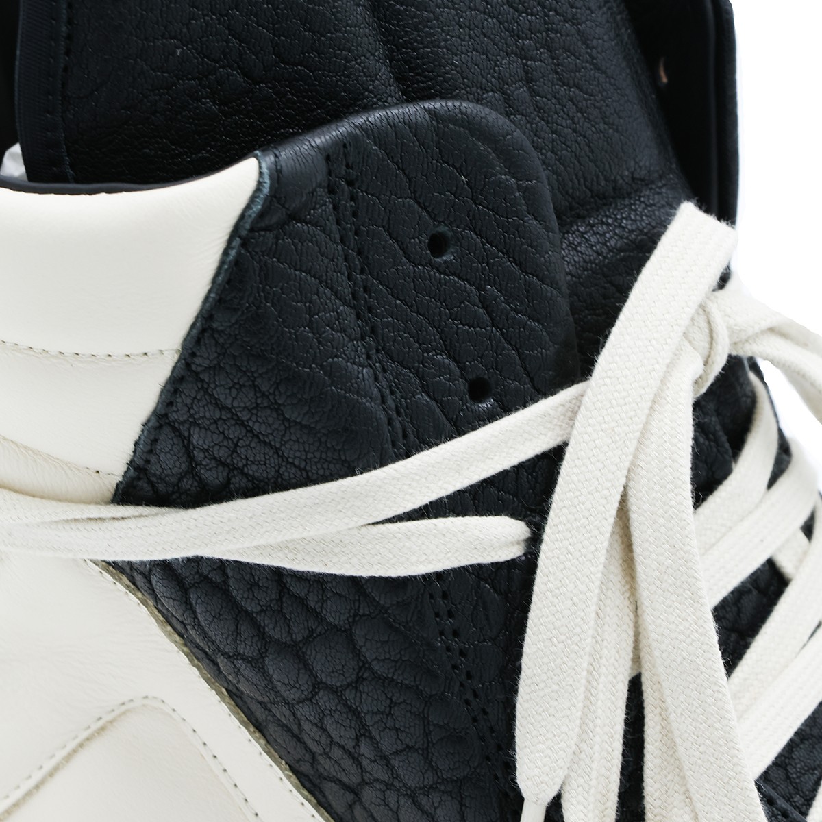 BLACK AND WHITE LEATHER GEOBASKET...