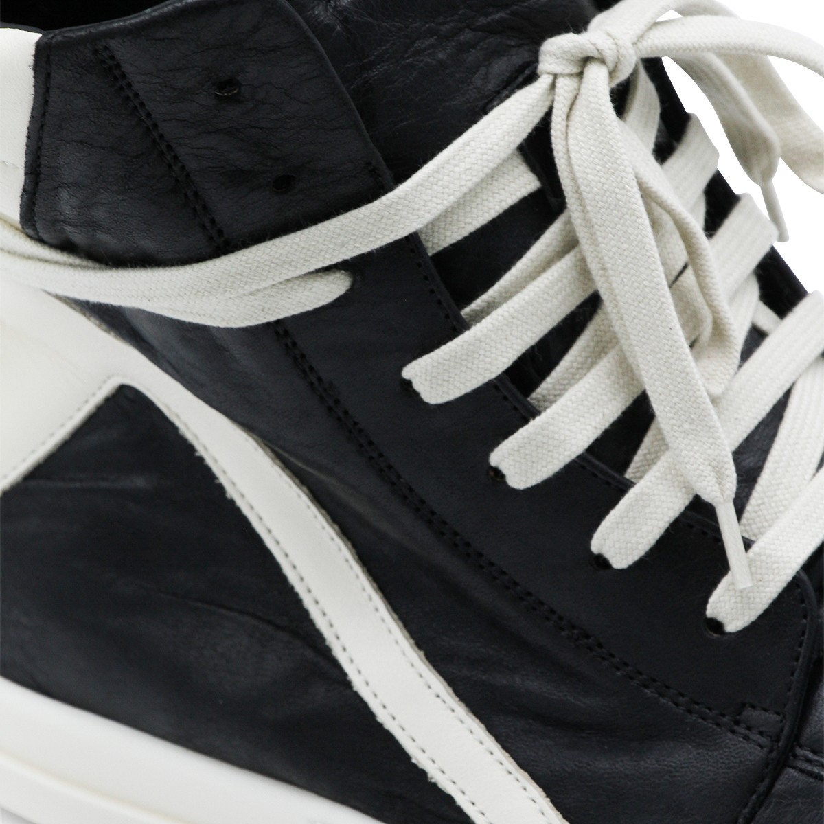 BLACK AND WHITE LEATHER GEOBASKET...